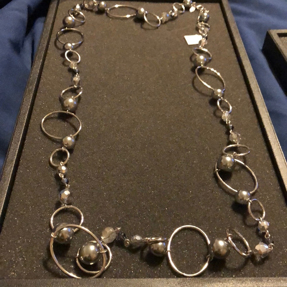 Silver circle and beaded necklace.